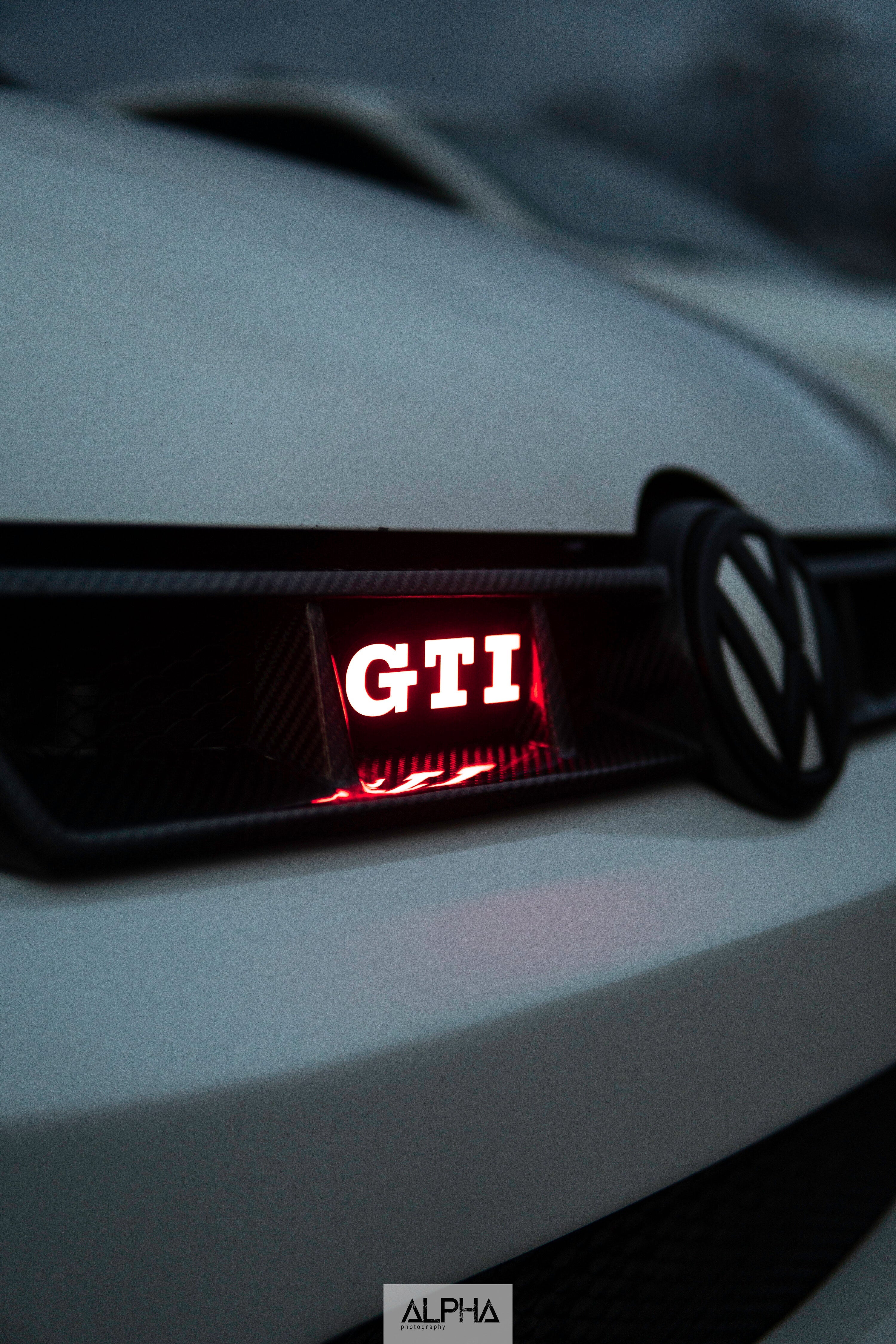 GTI : Illuminated Multicolor LED Badge - RGB Halo Kits Multicolor Flow Series Color Chasing RGBWA LED headlight kit Oracle Lighting Trendz OneUpLighting Morimoto theretrofitsource AutoLEDTech Diode Dynamics